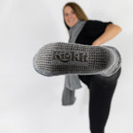 Gray socks with fleece lining. Silicone grippers on bottom for non-slip