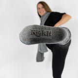 Gray socks with fleece lining. Silicone grippers on bottom for non-slip