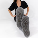 Gray socks with fleece lining. Silicone grippers on bottom for non-slip