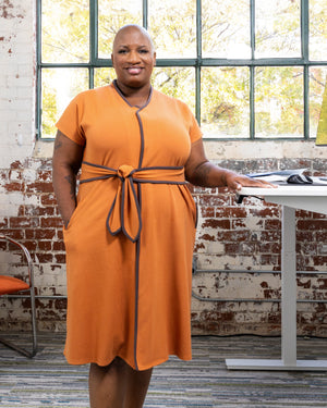 Load image into Gallery viewer, Full shot of the cinnamon dress in a lifestyle work environment
