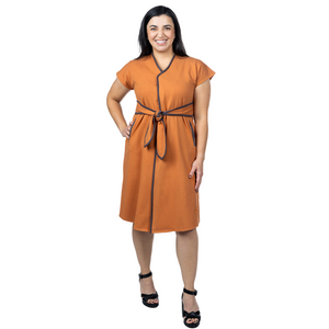 Load image into Gallery viewer, Introducing the KickIt Kristin Dress with Wrap Sash, a functional and flattering dress designed for both style and practicality. A center front zipper allows for ease of taking on and off to accommodate those with limited range of motion or loss of manual dexterity due to arthritis or weakness. The front wrap sash allows for adjustability and creates a flattering silhouette. The Kristin Dress is functional, allowing access to medical lines in treatment centers. &nbsp;Hidden and reinforced interior pockets a
