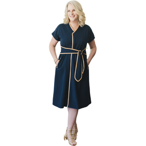 Load image into Gallery viewer, Introducing the KickIt Kristin Dress with Wrap Sash, a functional and flattering dress designed for both style and practicality. A center front zipper allows for ease of taking on and off to accommodate those with limited range of motion or loss of manual dexterity due to arthritis or weakness. The front wrap sash allows for adjustability and creates a flattering silhouette. The Kristin Dress is functional, allowing access to medical lines in treatment centers. Hidden and reinforced interior pockets
