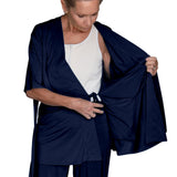 woman wearing navy mastectomy pajamas showing the inside drain pocket and the inside tie functionality