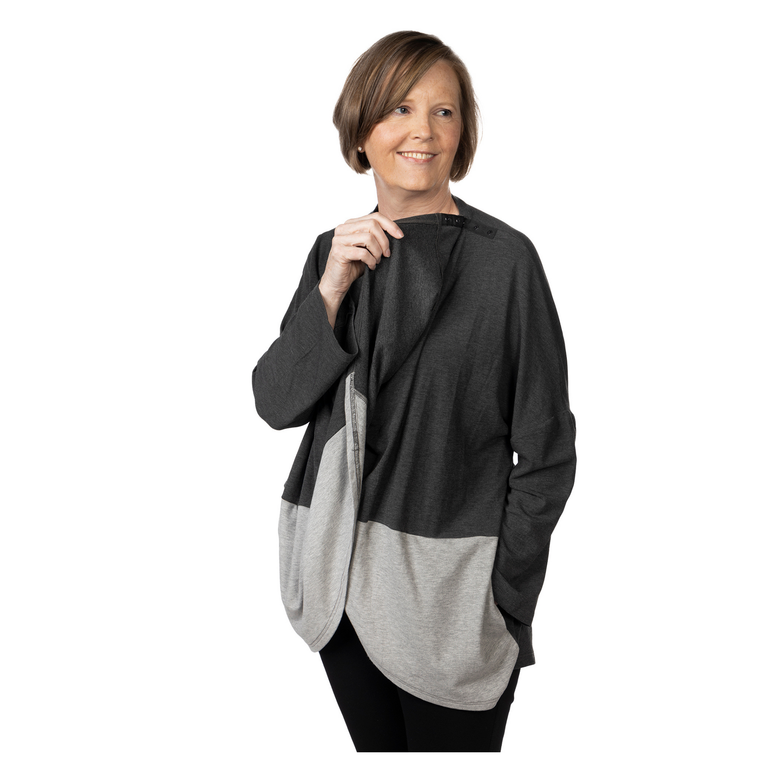 The KickIt Cardigan is a versatile garment, offering anT. Additionally, it serves as a reliable companion for staying cozy during chilly infusion sessions and is ingeniously tailored to provide comfort during chemotherapy treatments. Designed with consideration for individuals with limited arm mobility, the KickIt Cardigan has a single snap on top of the shoulder, ensuring effortless wear and removal. Its timeless design transcends seasons, adding a touch of elegance to any ensemble.