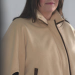 call out for easy IV and medical device access, wide sleeves to accomodate swelling and prevent chafing, simple to put on and remove with large button under sleeve