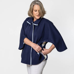Load image into Gallery viewer, Chemo cape functionality showing the underarm button also making it perfect for shoulder surgery recovery. Also has a front zipper and inside fleece.
